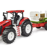 Bruder - Roadmax -Tracteur avec remorque forestière et 3 troncs d’arbre